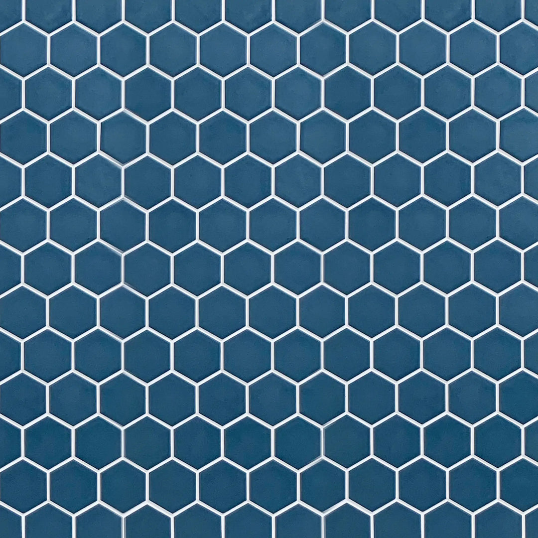Display board featuring Wave Navy Blue 2-inch Hexagon Matte Porcelain Mosaic Tile – elegant navy blue pattern layout.