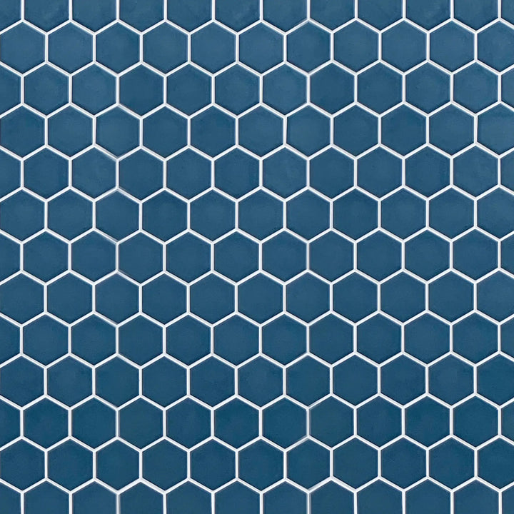 Display board featuring Wave Navy Blue 2-inch Hexagon Matte Porcelain Mosaic Tile – elegant navy blue pattern layout.