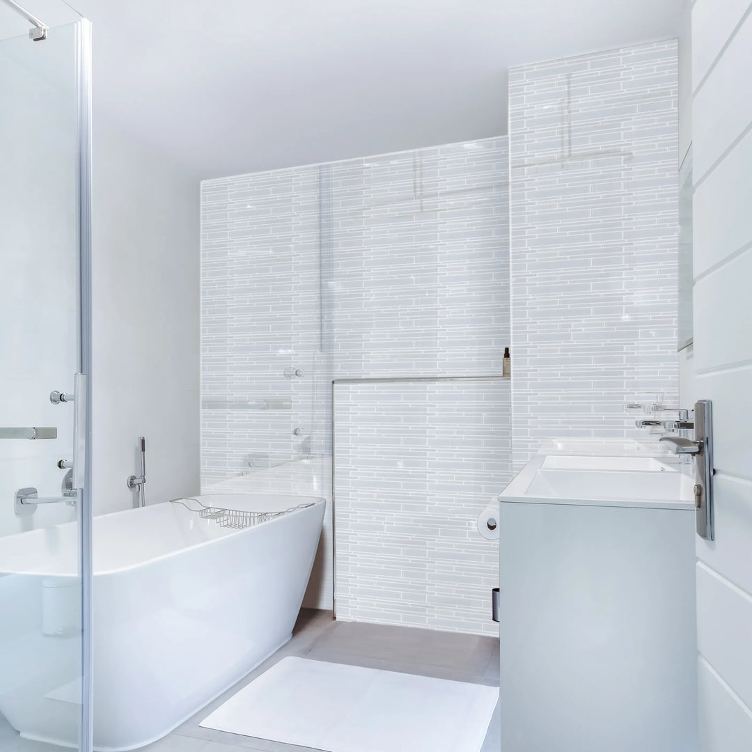 Bathroom wall tiled with Ice Glass Mix Random Strip Decorative Mosaic Tiles – frosted and clear glass creating a serene atmosphere.