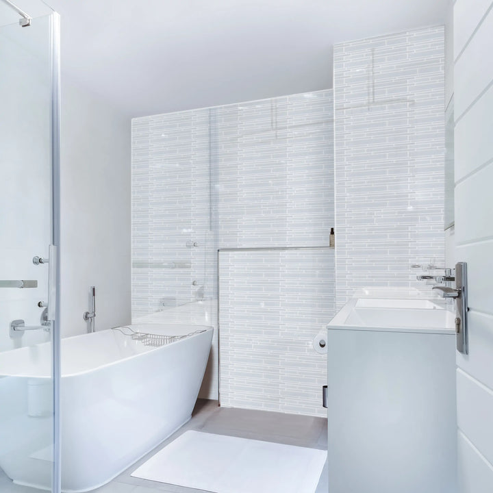 Bathroom wall tiled with Ice Glass Mix Random Strip Decorative Mosaic Tiles – frosted and clear glass creating a serene atmosphere.