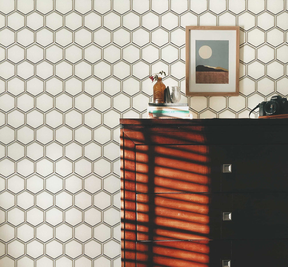 Living room design showcasing 9x11 inch 3” Hexagon Silver Glass Mosaic Tiles with Silver Trim – a contemporary and luxurious touch with hexagonal tiles and silver detailing