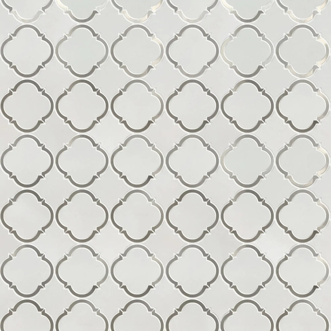 Sample board of Thassos & Patterned Metal Trim Waterjet Mosaic Tile – elegant showroom presentation of marble and metal combination