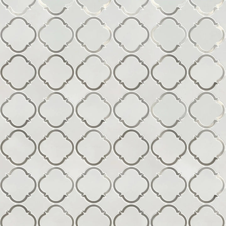 Sample board of Thassos & Patterned Metal Trim Waterjet Mosaic Tile – elegant showroom presentation of marble and metal combination