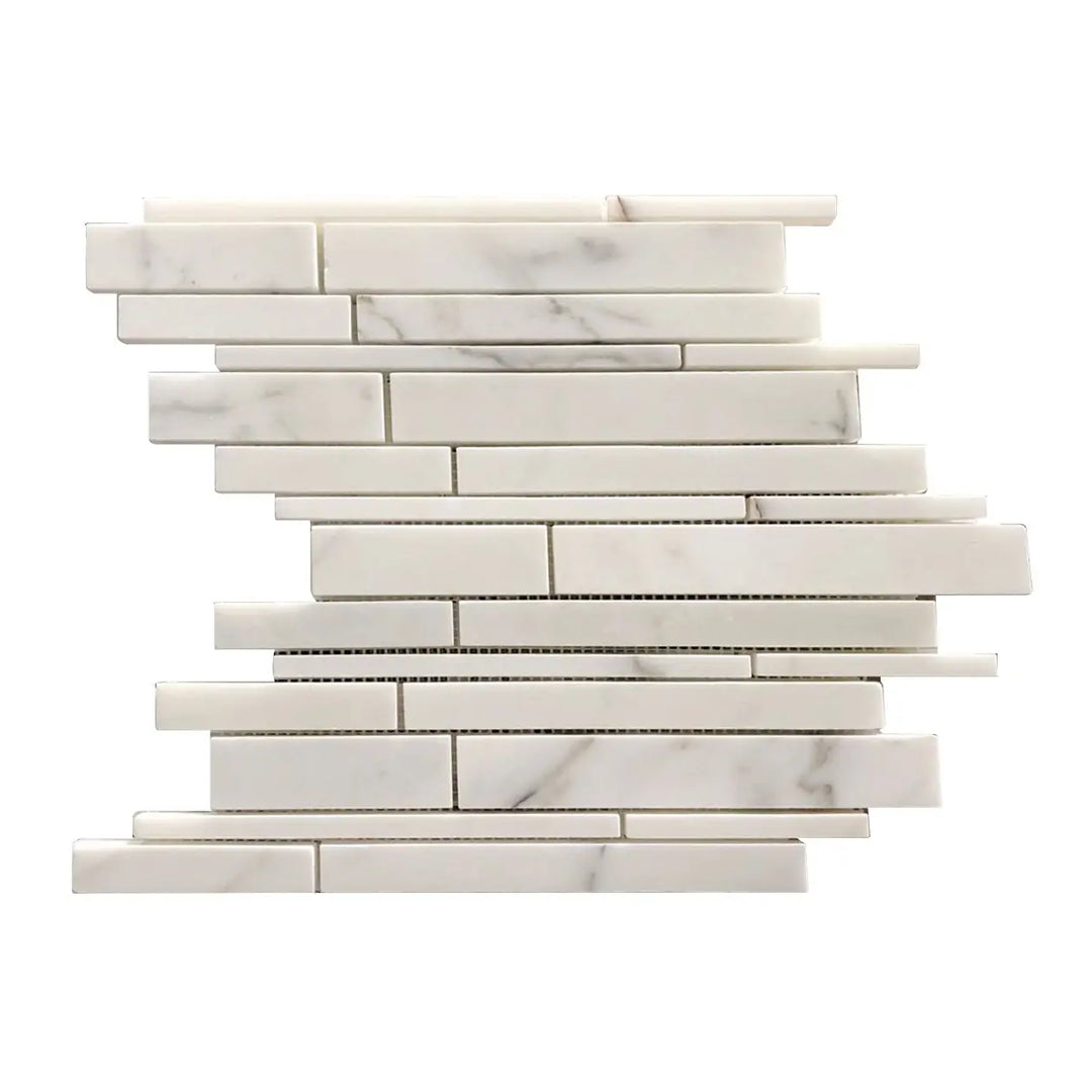 Single sheet of Calacatta Random Liners Mosaic Tile – 12x12 inch honed marble in linear random strip pattern