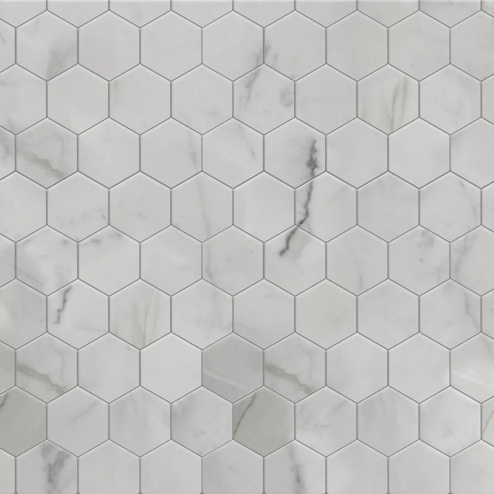 Sample display board of Calacatta Hexagon Honed Marble Mosaic – elegant natural stone for showroom or design pitch