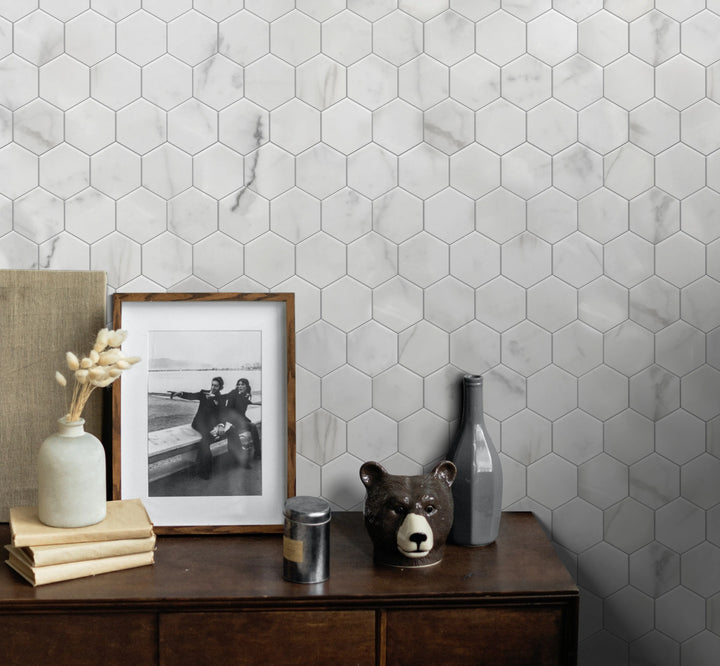  Living room accent wall with Calacatta Hexagon Honed Marble Mosaic Tile – elegant gold veining for refined interiors