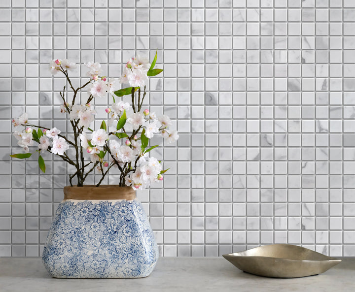 Living room accent wall with Calacatta Polished Marble Mosaic Tile – classic white marble veining enhances décor