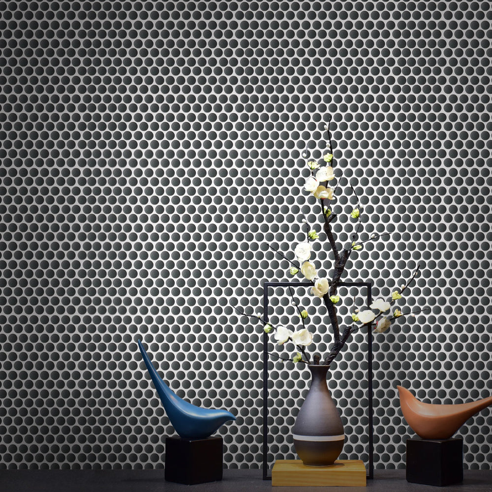 Black penny round mosaic flooring in contemporary living space – 12.4-in x 11.5-in porcelain tile.