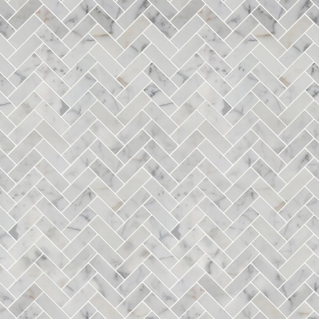 Sample display board of Calacatta Herringbone Honed Marble Mosaic Tile – elegant tile layout for showroom